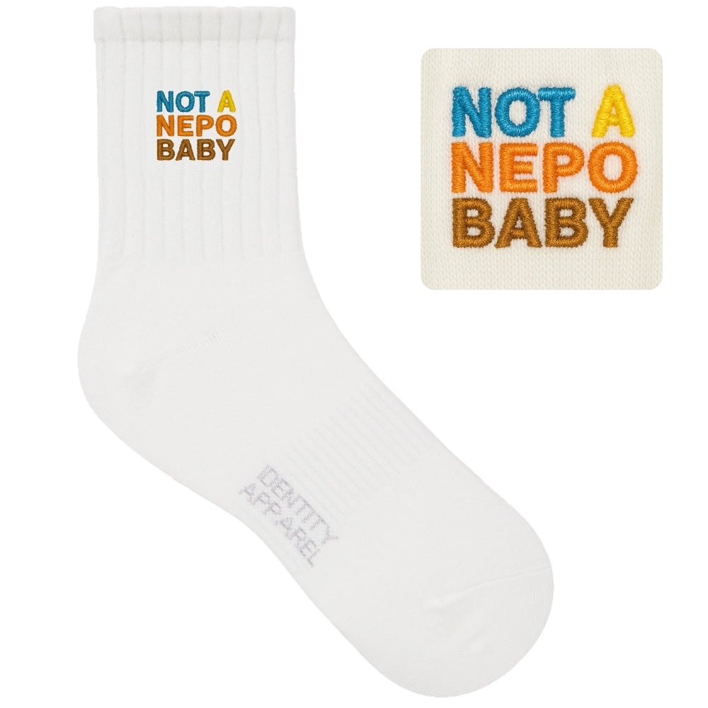 White sock with 'Not a Nepo Baby' text and matching patch on a white background