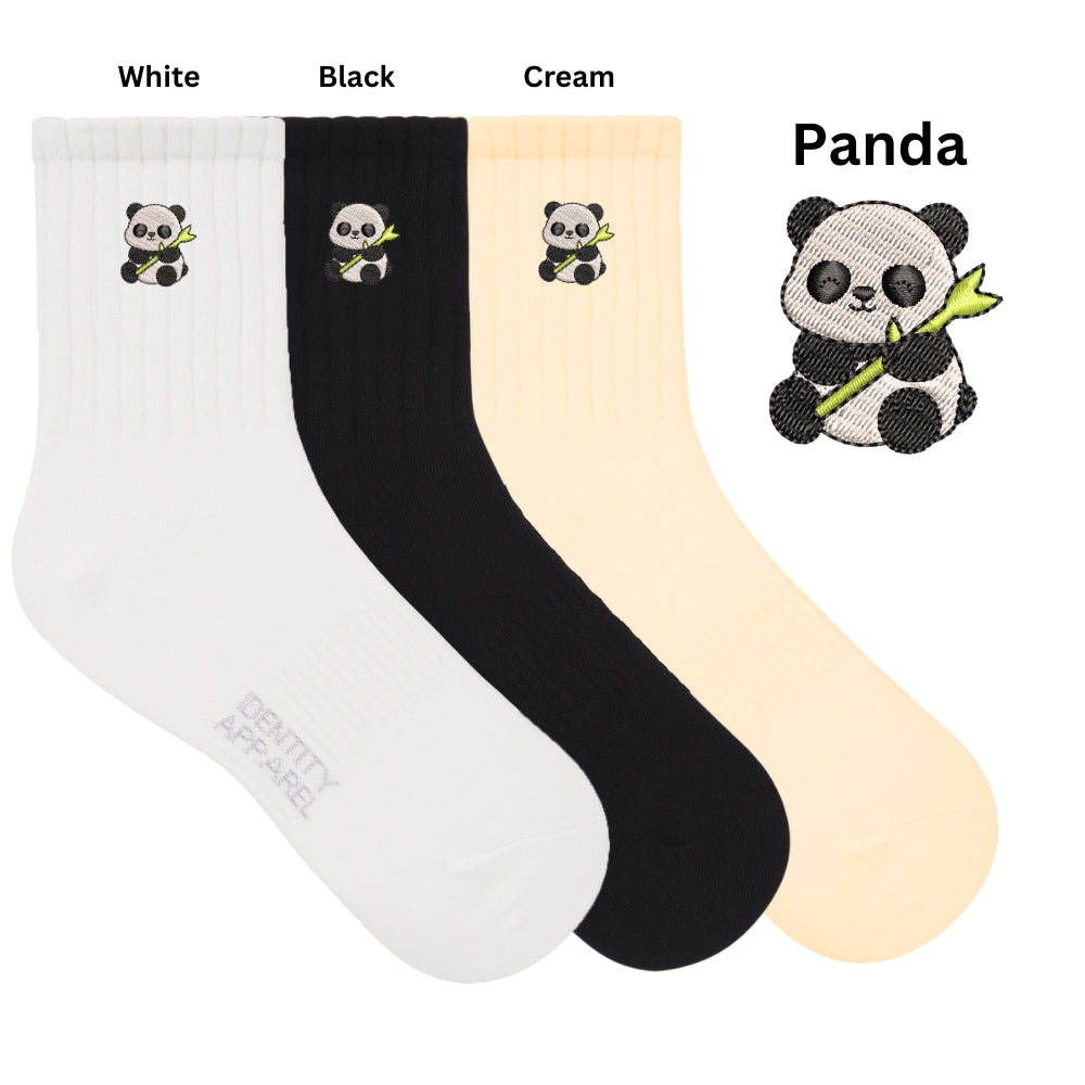 Three pairs of socks in white, black, and cream with panda designs on a white background.